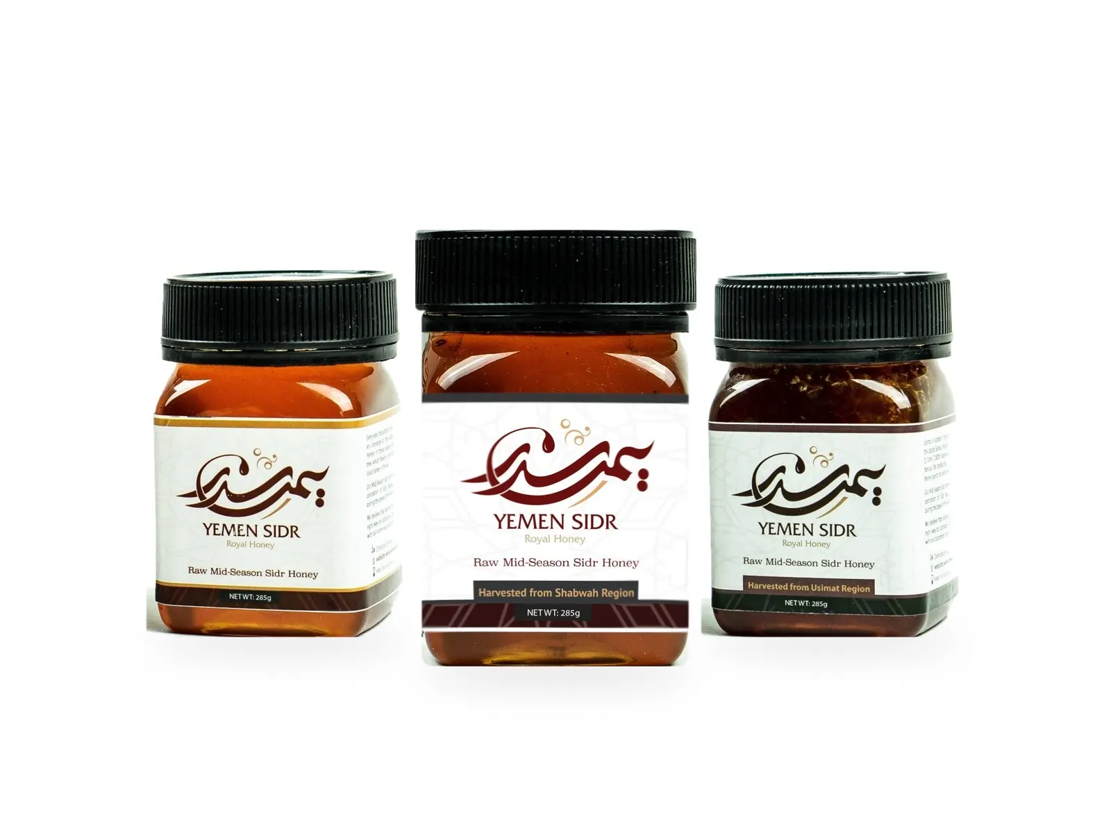 Three 285 g jars of raw Yemeni Sidr honey side by side: Hadrami, Shabwani and Usimi with its honeycomb